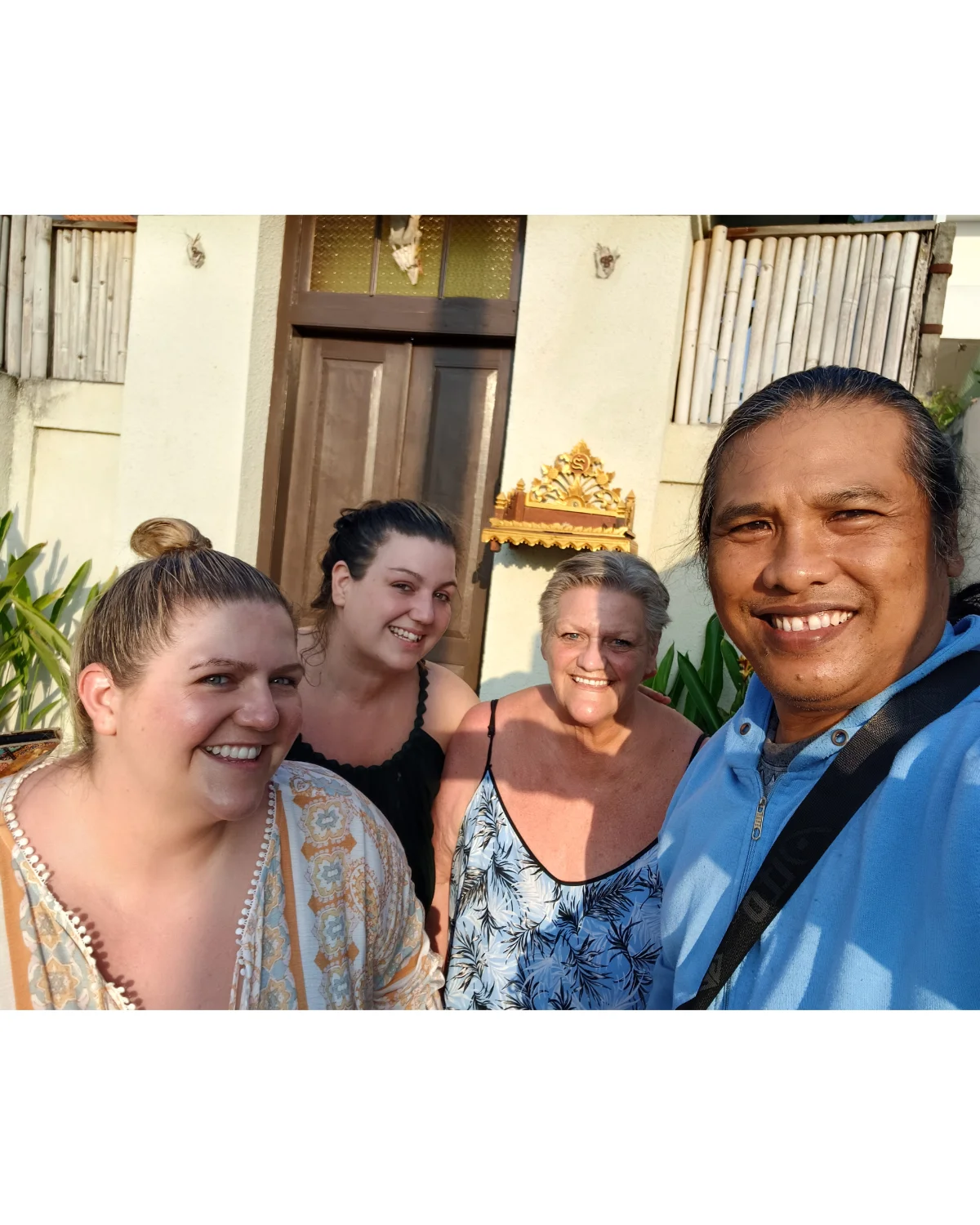 Collector reviewing Bali custom art piece